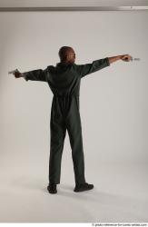 ERIC PILOT STANDING POSE WITH GUNS